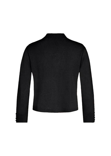 A person with curly hair is wearing a black long-sleeve Black Cardigan - SC-DOLLIE 662 - Soyaconcept over a black top and a white skirt with black horizontal stripes. The individual stands against a plain white background, looking directly at the camera.