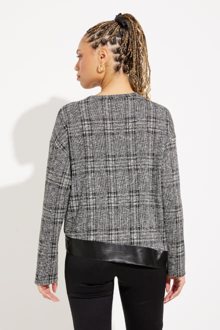 A woman with braided hair wears the black and multi-colored Checkered Faux Leather Top Style 233252 by Joseph Ribkoff, paired with black pants as she stands against a white background. She is slightly angled to one side, with a relaxed expression.