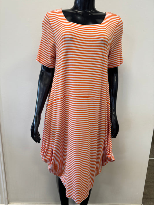 A mannequin is dressed in the versatile and comfortable FOIL Time Square Dress Shirt - FO6874, which features horizontal orange and white stripes. The dress shirt has a flowing, asymmetrical hemline and hangs loosely at the sides. The mannequin is positioned against a plain, white background.