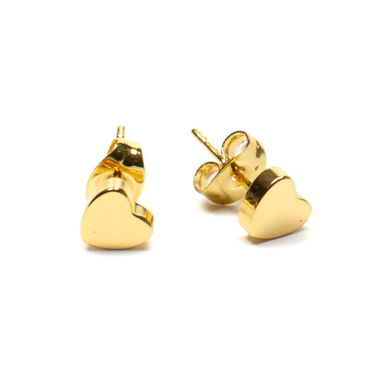 A set of small, shiny gold-plated heart-shaped stud earrings with butterfly backs from Suzie Blue. The Heart Studs are handmade and positioned upright with a slight tilt, beautifully displaying their polished, reflective surface against a plain white background.