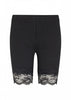 SoyaConcept's Black Shorts for women feature a delicate floral lace trim along the hem, adding a stylish and feminine touch. These classic fitted shorts can be effortlessly paired with a white tank top, making them a versatile wardrobe essential. An elastic waistband ensures a comfortable fit.