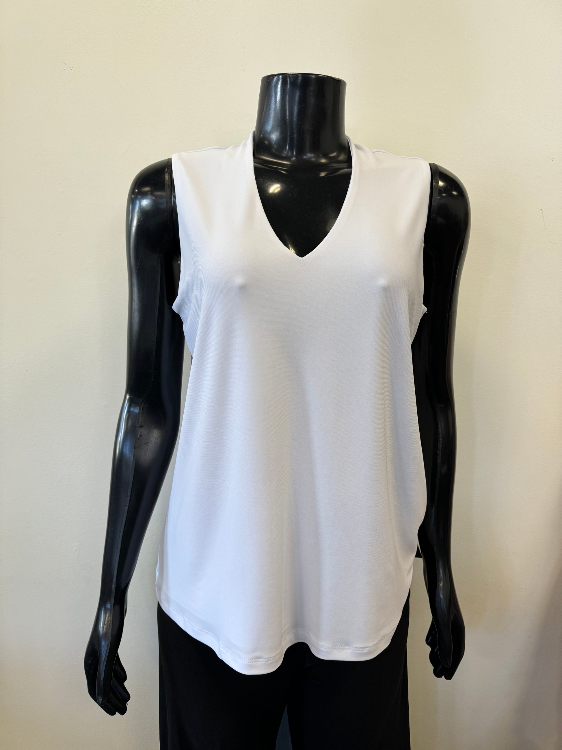 A black mannequin displays a sleeveless, deep V-neck, navy blue Bali Corp Bali Top Sleeveless 8326 paired with black trousers. The versatile top is made in Canada and stands out against the plain, white background.