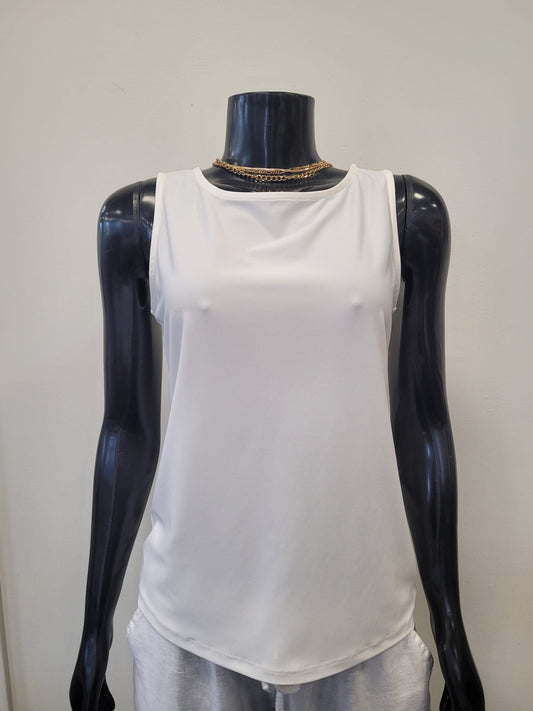 A black mannequin wears the Tank Top 6990-Bali Corp, a creamy white round neck design by Bali Corp, styled with a gold chain necklace against a plain light background.