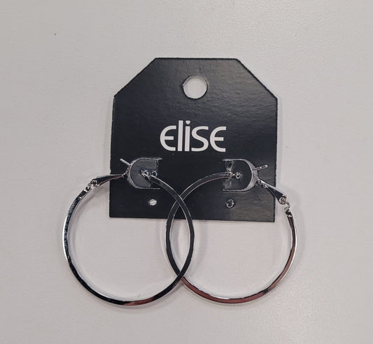 Dana 79 Earrings by Elise accessories—large silver hoops with a square edge design, displayed on a black "elise" tag against a white background—are perfect for a timeless, elegant look.