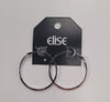 Dana 79 Earrings by Elise accessories—large silver hoops with a square edge design, displayed on a black "elise" tag against a white background—are perfect for a timeless, elegant look.