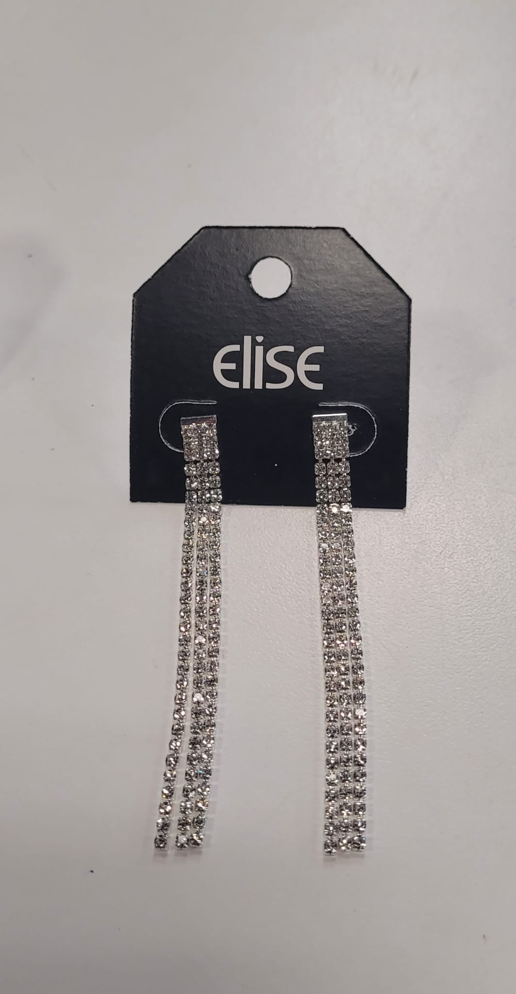 The Dana 91 Earrings by Elise accessories are long, silver dangle earrings with sparkling rhinestones and a crystal design, displayed on a black Elise card against a white background.