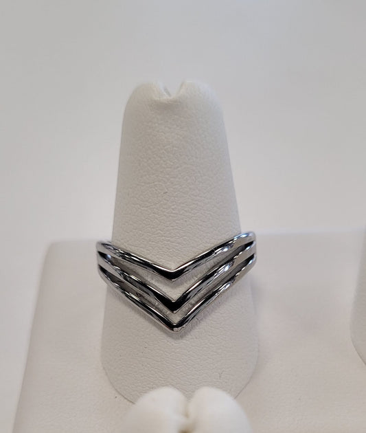The Elise accessories Nia 4 Ring, with a three strand V design, is shown upright on a white ring holder against a simple light background.