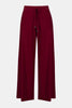 Joseph Ribkoff Sequined Sweater Knit Culotte Pants 244922F25 feature a wide-leg silhouette, elastic waistband with drawstring, and subtle sparkly speckles throughout the maroon sequin sweater knit fabric.