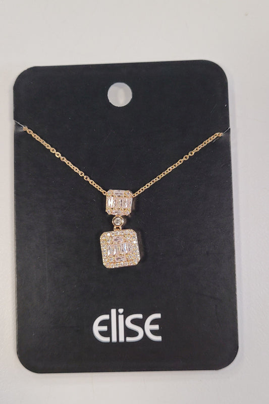 The Trina-2 Necklace from Elise accessories features an elegant gold chain with two CZ square diamond-studded pendants, displayed neatly on a black "elise" card—an ideal piece for any jewelry collection.