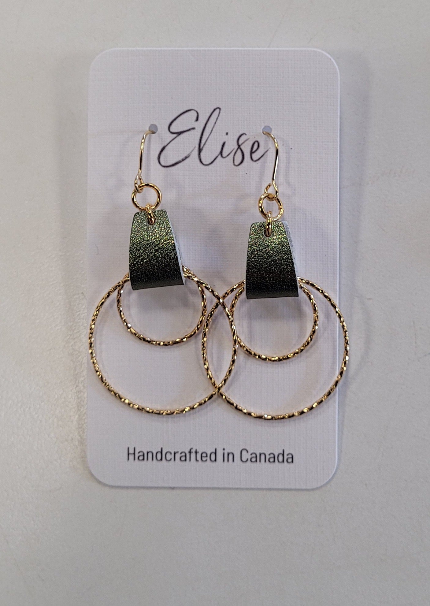A pair of Elise Earrings by Elise Accessories with gold double hoops and dark green rectangular tops, displayed on a card labeled "Elise Handcrafted in Canada.