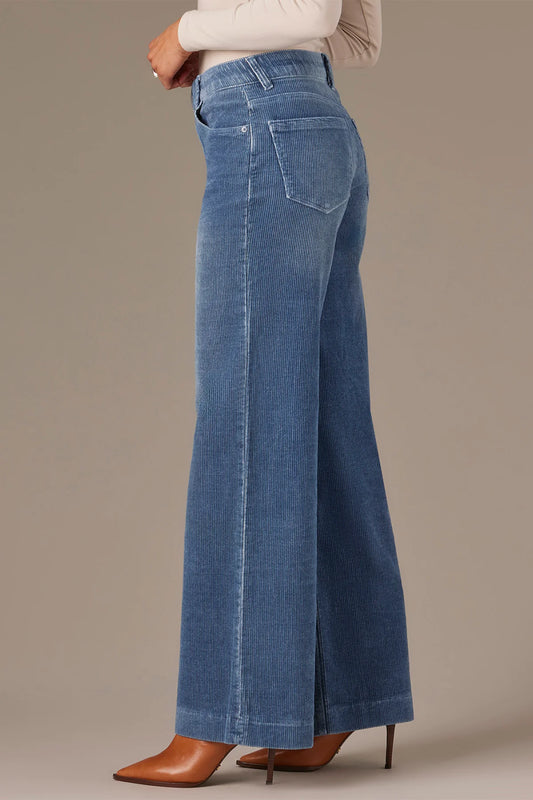 The SAM High Rise Wide Leg Petite Jeans by Wit & Wisdom, featuring Contour Shape Technology, are shown in blue against a white background.