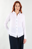 A person with long red hair is wearing the URBAN SNOW TOP by Oh My Gauze and dark pants. They smile slightly, standing relaxed against a plain white background.