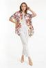 A woman models the LinenLuv French Linen Shirt TP1627-11 Bianco over a white top and pants, striking a pose against a white backdrop. Beige heels complement her chic look, while the eco-friendly natural European linen enhances her style.