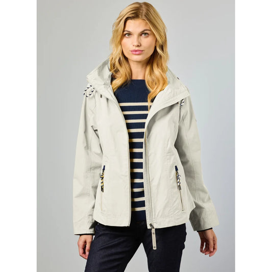 A woman with long blonde hair models the JUNGE Nera Jacket in Ecru (0126-2224-46), featuring a detachable hood, over a navy and white striped sweater against a plain light background.