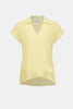 The Joseph Ribkoff Bubble Chiffon High-Low Layered Top (262148) features a light yellow crinkled fabric, V-neck shirt collar, short sleeves, and an asymmetric flared hem. Displayed on a plain white background.