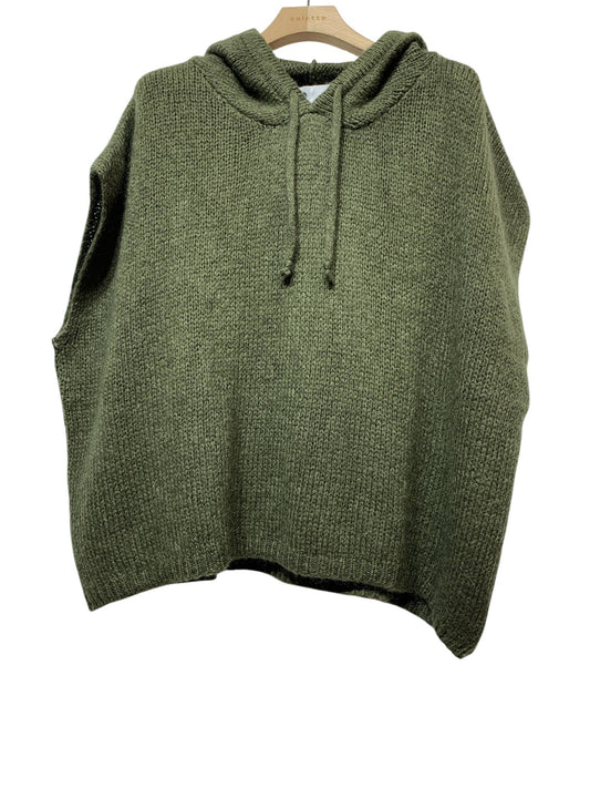 The 1622A PONCHO FALL WINTER: KAKI by LINEN & COTTON HOUSE is an olive green knitted sleeveless hoodie, inspired by the elegance of an Italian poncho, displayed on a wooden hanger against a white background—perfect as a cozy wrap for fall and winter.